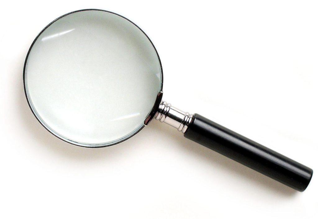 Magnifying glass to show the importance of focus in time management